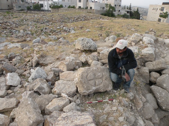 Fig. 13a. Trench 2-S: a block with a carved cross retrieved from the debris of Trench 2-S (image by Mariusz Burdajewicz).